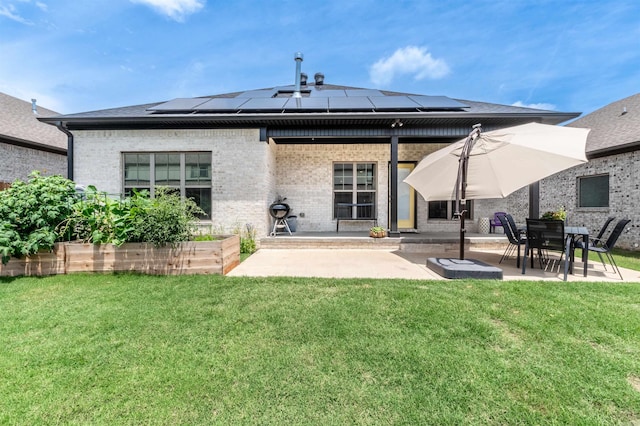 118 Lydia Dr, Maumelle, AR 72113 - rear view of house featuring a patio, brick siding, and a lawn