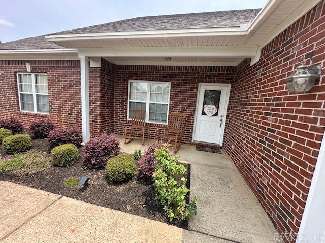 13815 Carrington Place Dr, Alexander, AR 72002 - entrance to property with brick siding and a shingled roof
