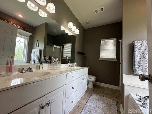 13815 Carrington Place Dr, Alexander, AR 72002 - full bath with double vanity, a stall shower, a garden tub, toilet, and tile patterned floors
