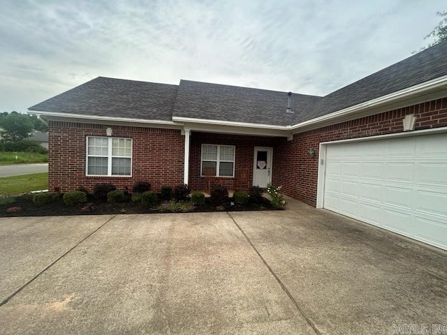 13815 Carrington Place Dr, Alexander, AR 72002 - ranch-style house featuring driveway, brick siding, roof with shingles, and an attached garage