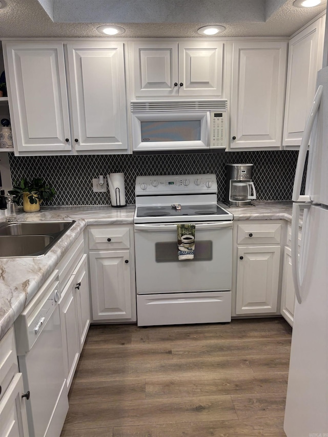 135 Hillview Dr Unit 19, Fairfield Bay, AR 72088 - kitchen with white appliances, white cabinets, dark wood-style flooring, a sink, and recessed lighting