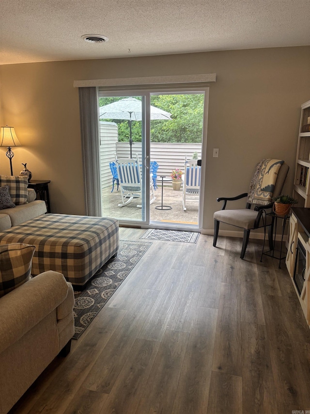 135 Hillview Dr Unit 19, Fairfield Bay, AR 72088 - bedroom with dark wood-style floors, access to exterior, and a textured ceiling