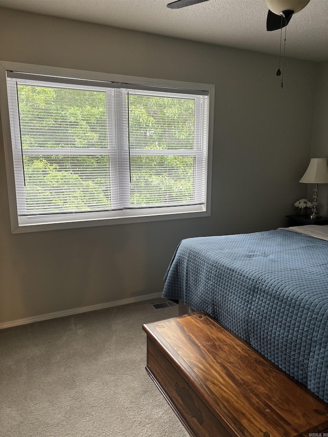 135 Hillview Dr Unit 19, Fairfield Bay, AR 72088 - carpeted bedroom featuring multiple windows, baseboards, and ceiling fan