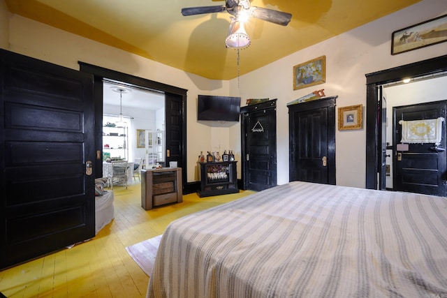 1107 Magnolia, Mena, AR 71953 - bedroom with hardwood / wood-style flooring and ceiling fan