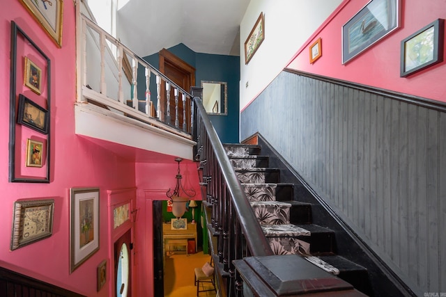 1107 Magnolia, Mena, AR 71953 - stairway featuring a towering ceiling