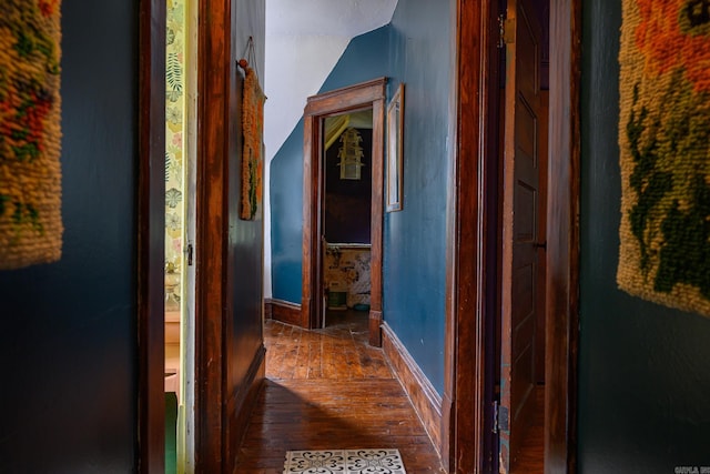 1107 Magnolia, Mena, AR 71953 - hall featuring dark wood finished floors, lofted ceiling, and baseboards