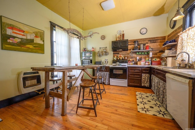 1107 Magnolia, Mena, AR 71953 - kitchen with dishwasher, electric stove, a sink, heating unit, and open shelves