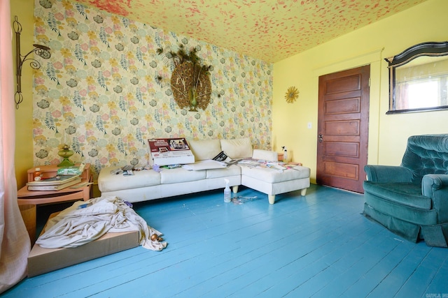 1107 Magnolia, Mena, AR 71953 - living room with wallpapered walls and wood finished floors