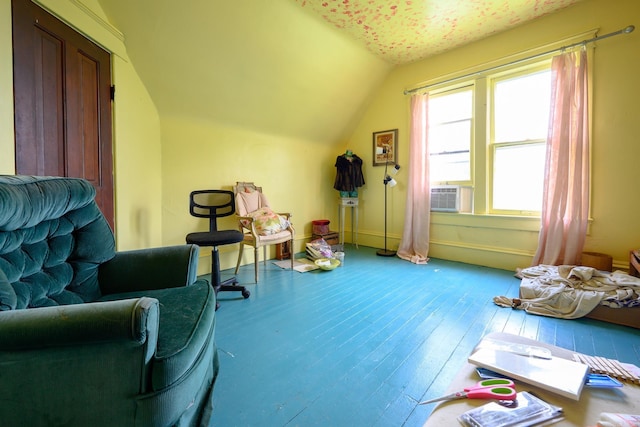 1107 Magnolia, Mena, AR 71953 - living area featuring vaulted ceiling, hardwood / wood-style flooring, and cooling unit
