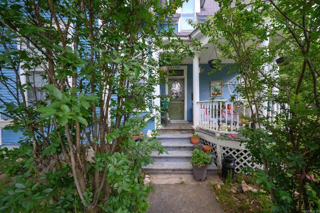 1107 Magnolia, Mena, AR 71953 - entrance to property featuring a porch
