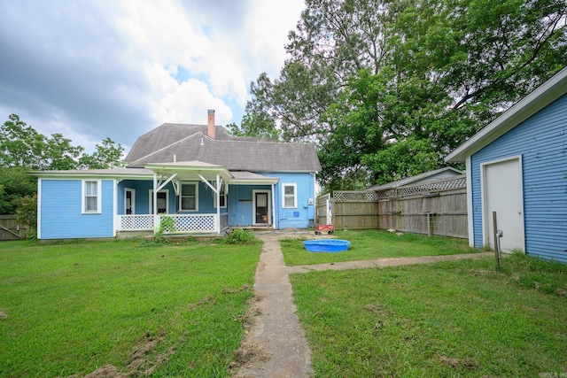 1107 Magnolia, Mena, AR 71953 - view of front of home with covered porch, a chimney, and roof with shingles