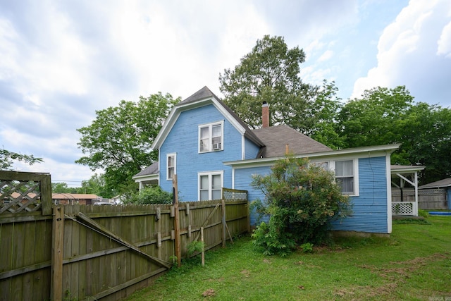1107 Magnolia, Mena, AR 71953 - rear view of property with a chimney