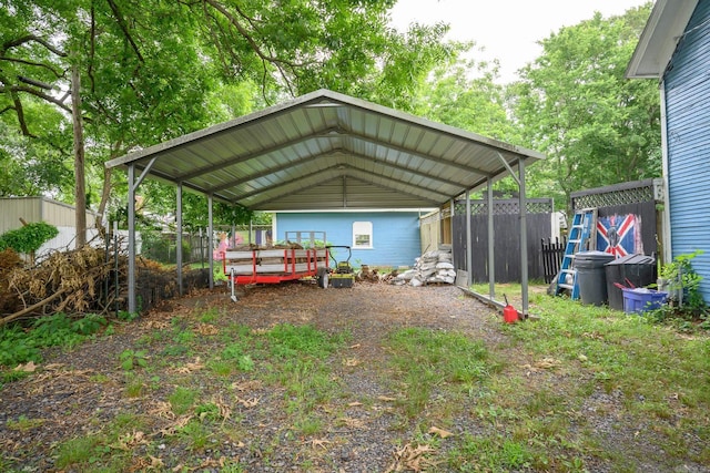 1107 Magnolia, Mena, AR 71953 - view of car parking with a detached carport