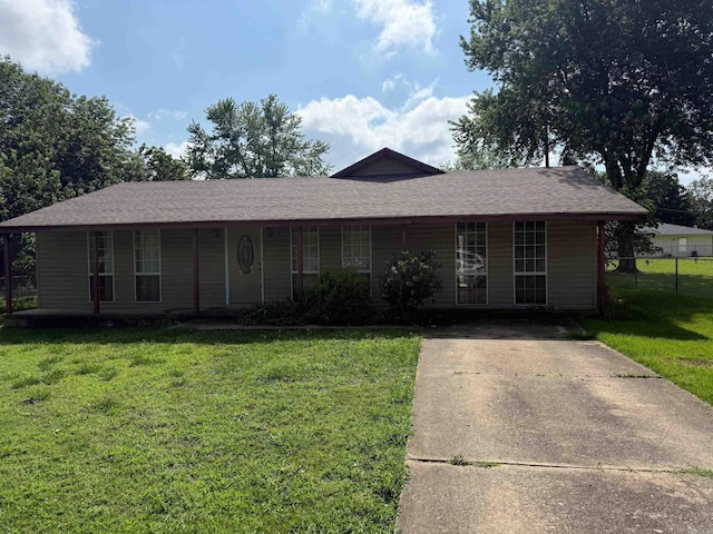 211 Turner St, Mena, AR 71953 - ranch-style house featuring driveway, covered porch, and a shingled roof