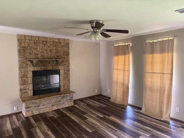 211 Turner St, Mena, AR 71953 - unfurnished living room with wood finished floors, a fireplace, a ceiling fan, and baseboards