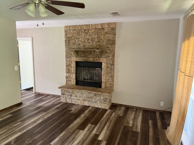 211 Turner St, Mena, AR 71953 - unfurnished living room with wood finished floors, ceiling fan, a fireplace, and baseboards