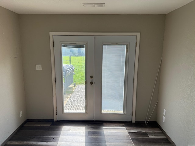 211 Turner St, Mena, AR 71953 - doorway to outside with french doors and dark wood-type flooring