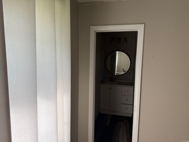 211 Turner St, Mena, AR 71953 - bathroom with vanity and wood finished floors