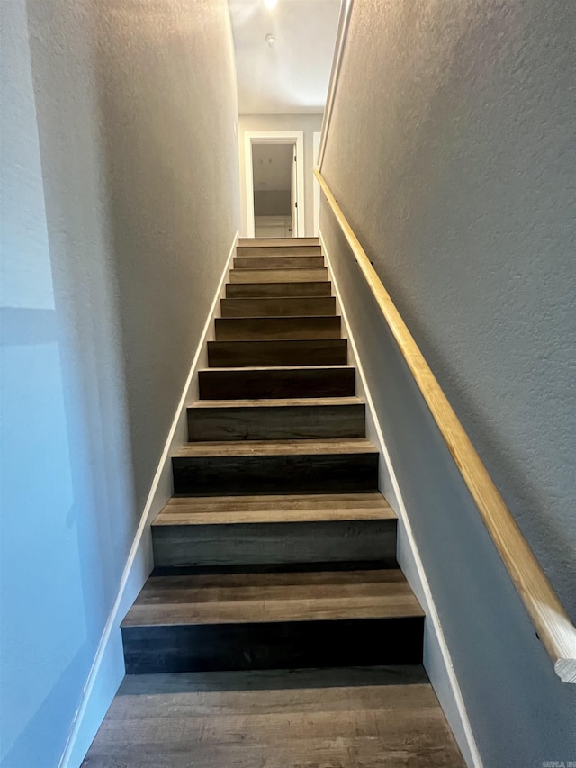 233 Iris, Benton, AR 72015 - stairway featuring a textured wall and wood finished floors