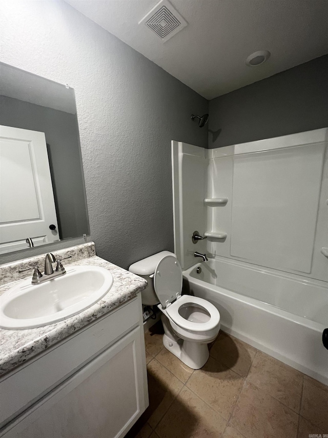 233 Iris, Benton, AR 72015 - bathroom with toilet, vanity, shower / bathtub combination, tile patterned flooring, and a textured wall
