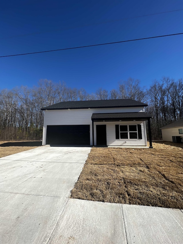 233 Iris, Benton, AR 72015 - view of front of house with concrete driveway and an attached garage