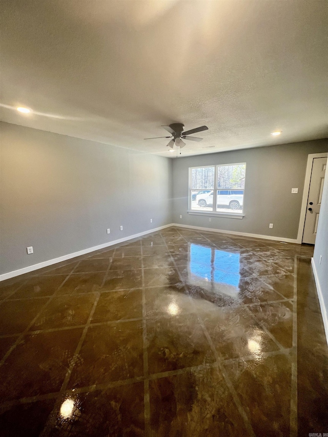233 Iris, Benton, AR 72015 - unfurnished room featuring baseboards, ceiling fan, and a textured ceiling