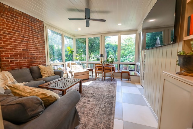 837 Maple St, Camden, AR 71701 - sunroom / solarium featuring an outdoor living space, brick wall, a ceiling fan, and tile patterned flooring