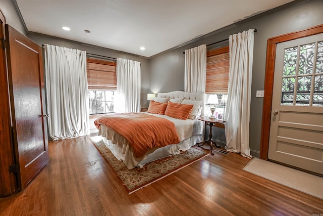 837 Maple St, Camden, AR 71701 - bedroom with multiple windows, wood finished floors, and recessed lighting