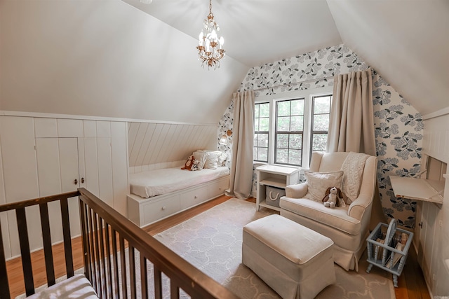 837 Maple St, Camden, AR 71701 - bedroom featuring vaulted ceiling, wood finished floors, a chandelier, and a wainscoted wall