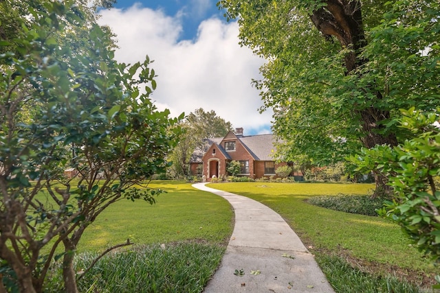 837 Maple St, Camden, AR 71701 - english style home featuring a front lawn and a chimney