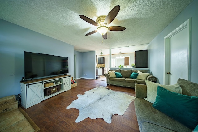 1417 Meadowbrook Dr, Heber Springs, AR 72543 - living area featuring a ceiling fan, a textured ceiling, a chandelier, and dark wood finished floors