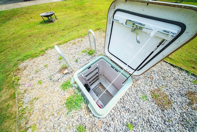 1417 Meadowbrook Dr, Heber Springs, AR 72543 - entry to storm shelter with a lawn