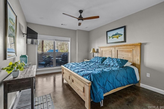 1912A5 Central Blvd, Bull Shoals, AR 72619 - bedroom featuring baseboards, finished concrete flooring, and ceiling fan