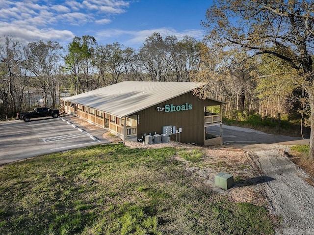 1912A5 Central Blvd, Bull Shoals, AR 72619 - view of side of home featuring metal roof and uncovered parking