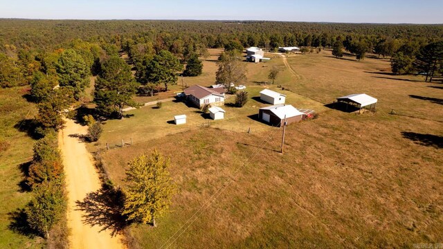 aerial view of sparsely populated area with a forest