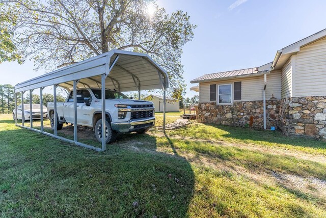 view of parking / parking lot featuring a carport and driveway