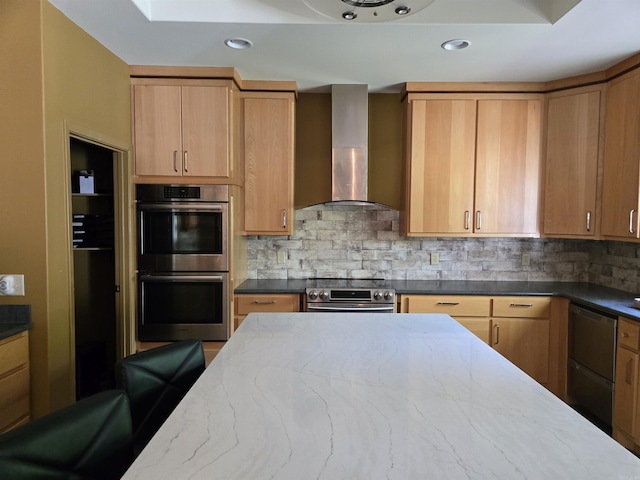 343 Boulder Rd, Royal, AR 71968 - kitchen featuring wall chimney range hood, appliances with stainless steel finishes, dark stone countertops, decorative backsplash, and recessed lighting