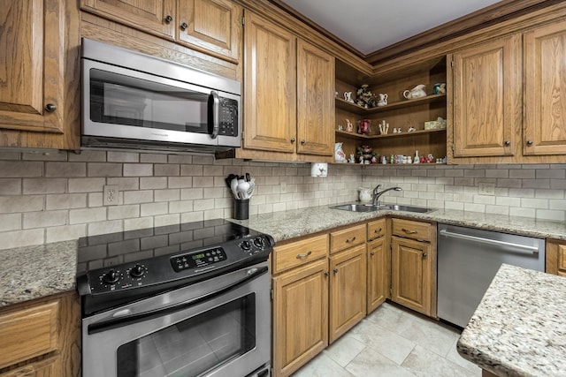 16 Masters Place Dr, Maumelle, AR 72113 - kitchen featuring appliances with stainless steel finishes, open shelves, a sink, tasteful backsplash, and brown cabinets