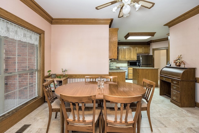 16 Masters Place Dr, Maumelle, AR 72113 - dining area with ornamental molding and ceiling fan