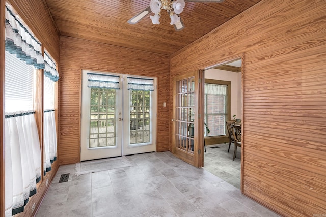 16 Masters Place Dr, Maumelle, AR 72113 - entryway with wood ceiling, ceiling fan, french doors, and wood walls