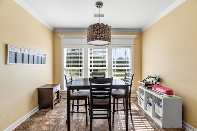 3 E Castlepines, Greenbrier, AR 72058 - dining space featuring healthy amount of natural light, baseboards, crown molding, and stone finish flooring