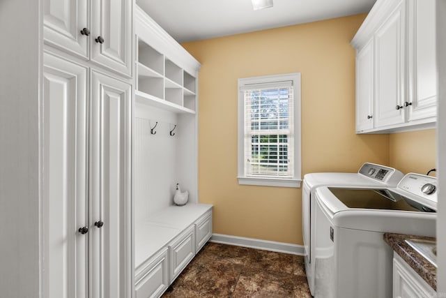 3 E Castlepines, Greenbrier, AR 72058 - laundry room featuring independent washer and dryer, cabinet space, baseboards, and dark stone finish floors