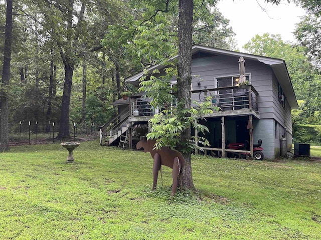 1702 E Spring Dr, Horseshoe Bend, AR 72512 - view of front of property featuring central AC unit, a deck, and stairway