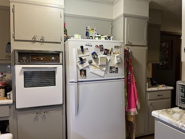 1702 E Spring Dr, Horseshoe Bend, AR 72512 - kitchen with white appliances and light countertops