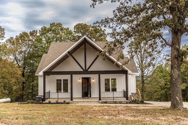 38 Oak Ridge Dr, Gepp, AR 72538 - view of front of home featuring covered porch, roof with shingles, central AC unit, and a front lawn