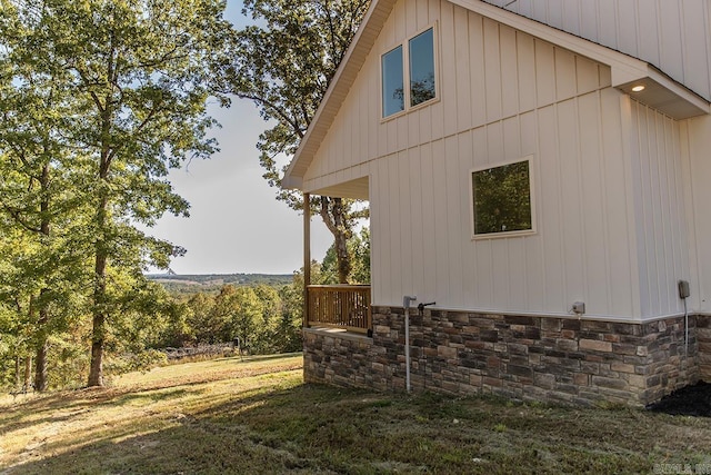 38 Oak Ridge Dr, Gepp, AR 72538 - view of home's exterior with stone siding and a lawn