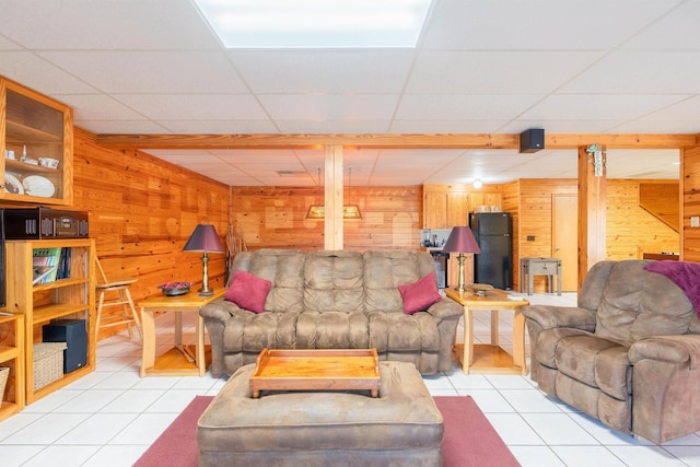 325 Wesley Chapel Rd, Quitman, AR 72131 - living room with wooden walls, tile patterned floors, and a drop ceiling
