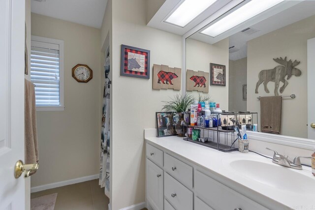 111 Country Oaks Dr, Malvern, AR 72104 - bathroom with vanity, baseboards, and tile patterned floors