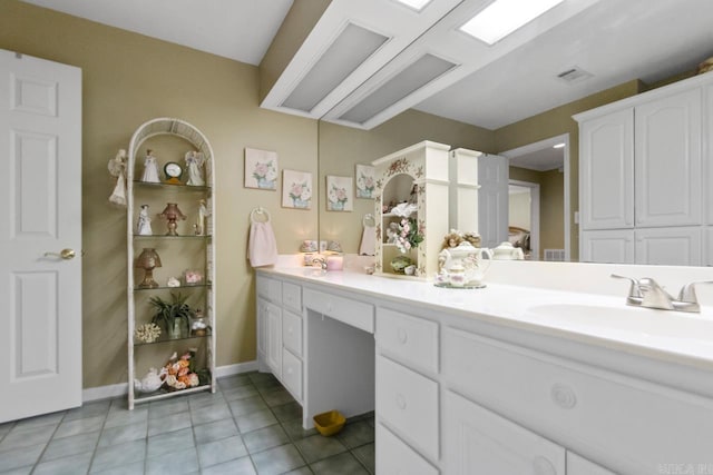 111 Country Oaks Dr, Malvern, AR 72104 - bathroom featuring double vanity, tile patterned floors, and baseboards