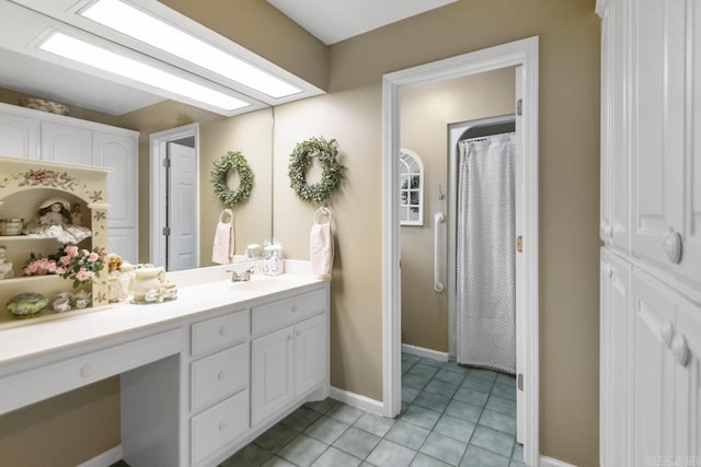 111 Country Oaks Dr, Malvern, AR 72104 - bathroom featuring vanity, tile patterned floors, and baseboards